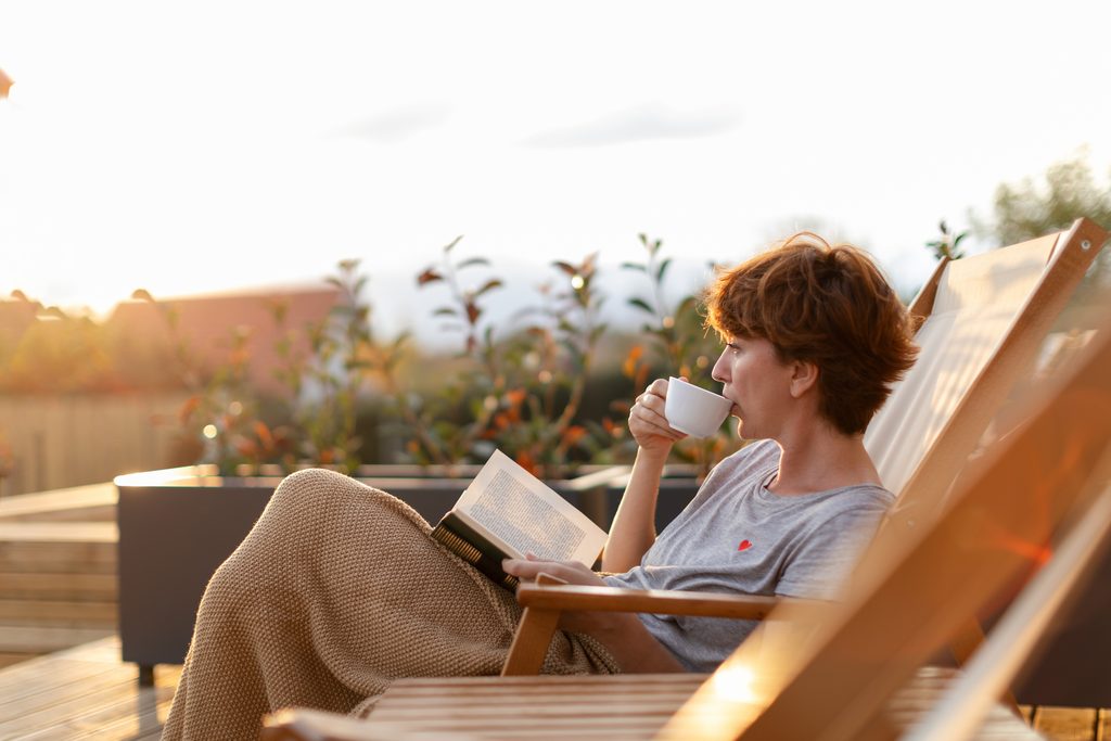 beautiful woman enjoying on patio at home